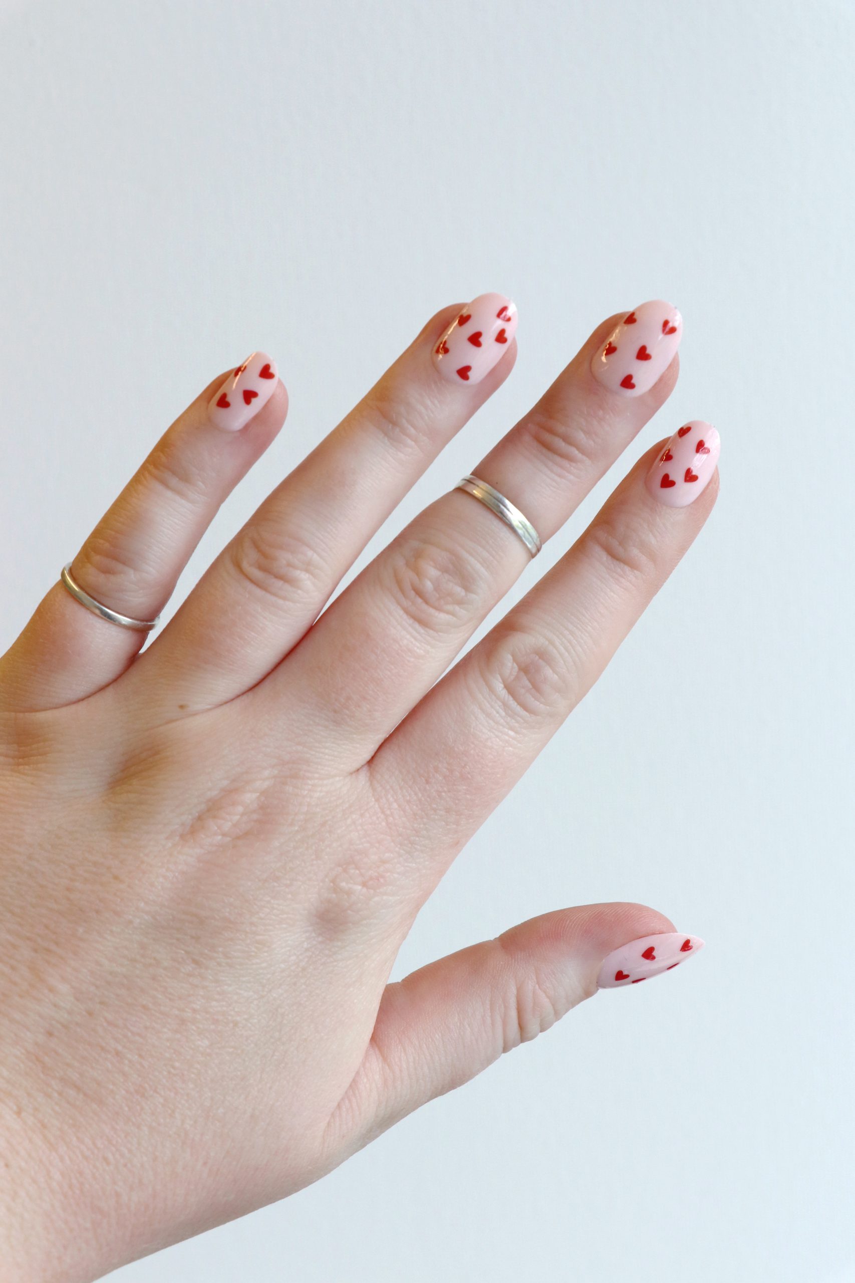 Medium Oval Pale Pink Tiny Scattered Hearts Medium Oval Pale Pink Tiny Scattered Hearts — Heart Nails