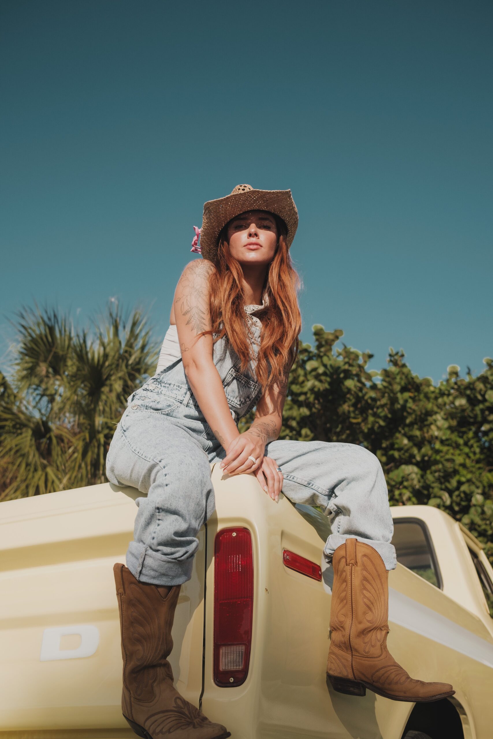 Light Blue Denim Overalls with Straw Cowboy Hat — Coastal Cowgirl Outfits