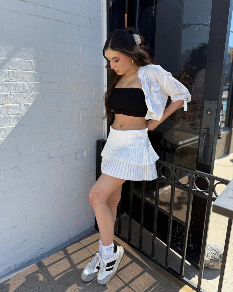 Black Tube Top, Denim Jacket, and Pleated Mini Skirt for Trendy Daytime Black Tube Top, Denim Jacket, and Pleated Mini Skirt for Trendy Daytime — Latina Outfits