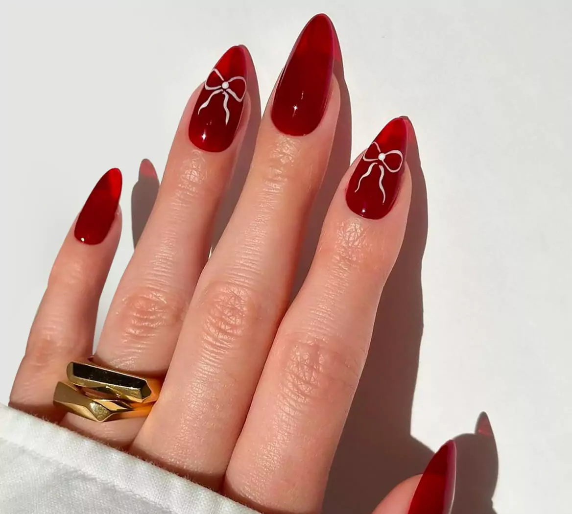 Jelly Red Almonds with White Bow Accents Jelly Red Almonds with White Bow Accents — Date Night Nails