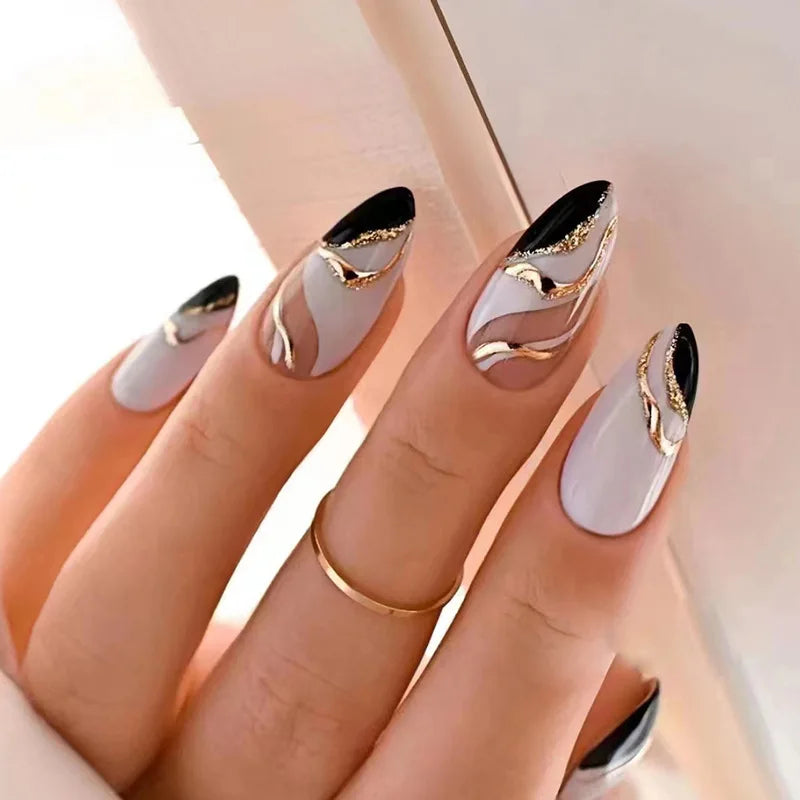 Medium Almond with Flowing Gold and Black Lines on Light Base — Black and Gold Nails