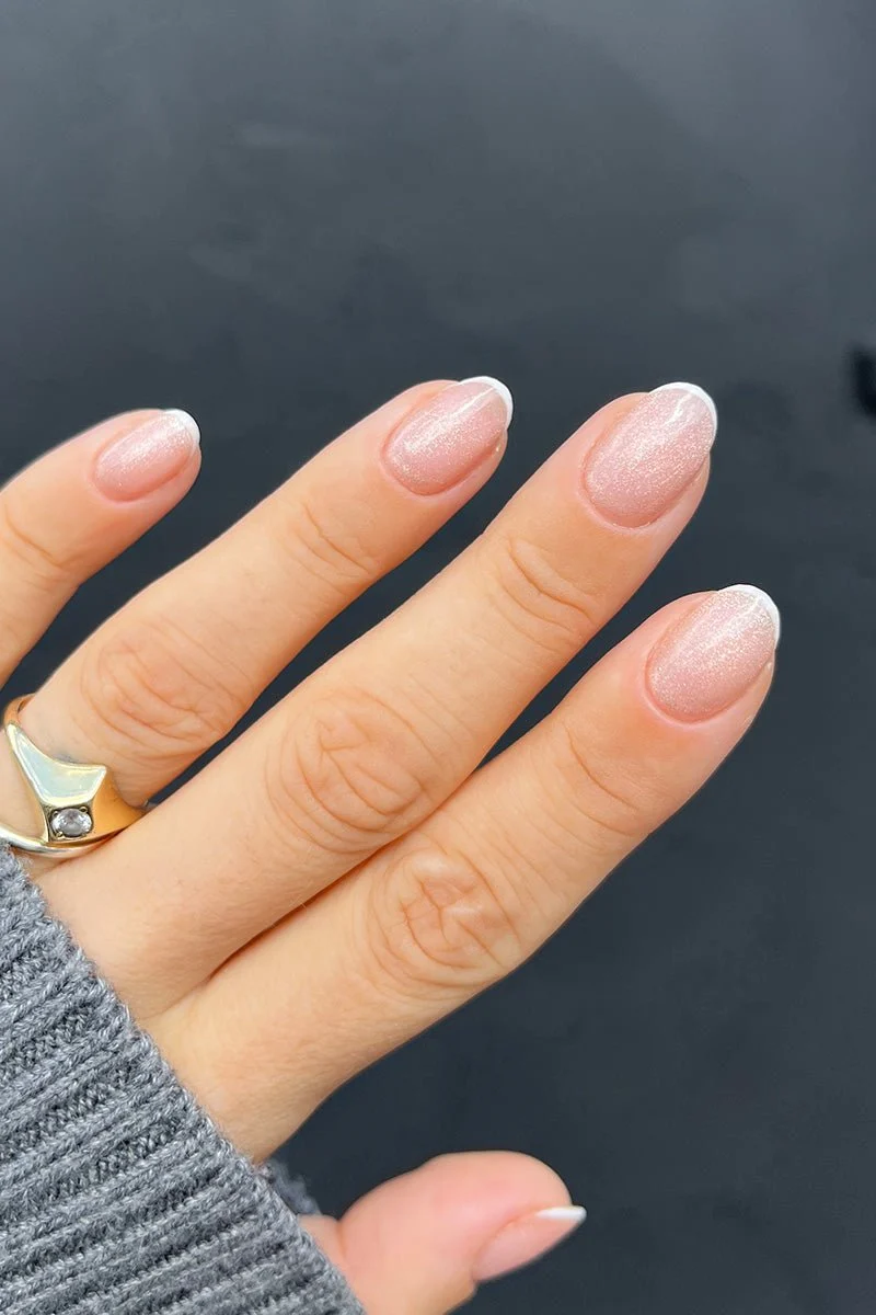 White French Tips On All Visible Nails Sheer Pink Shimmer French Oval White French Tips On All Visible Nails Sheer Pink Shimmer French Oval — Natural Nails