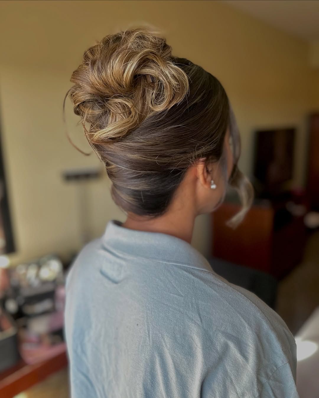 Voluminous Sculpted High Bun — Prom Hairstyles for Medium Hair