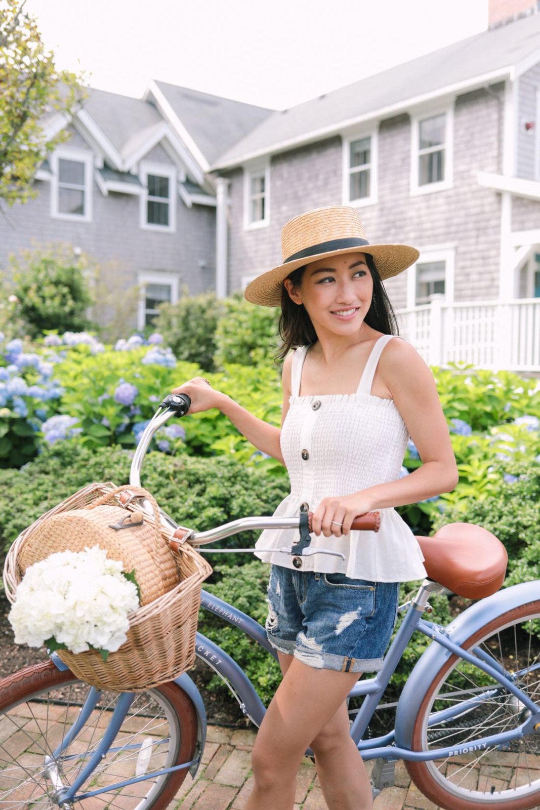 White Smocked Peplum Top with Denim Shorts and Straw Hat — Nantucket Outfits
