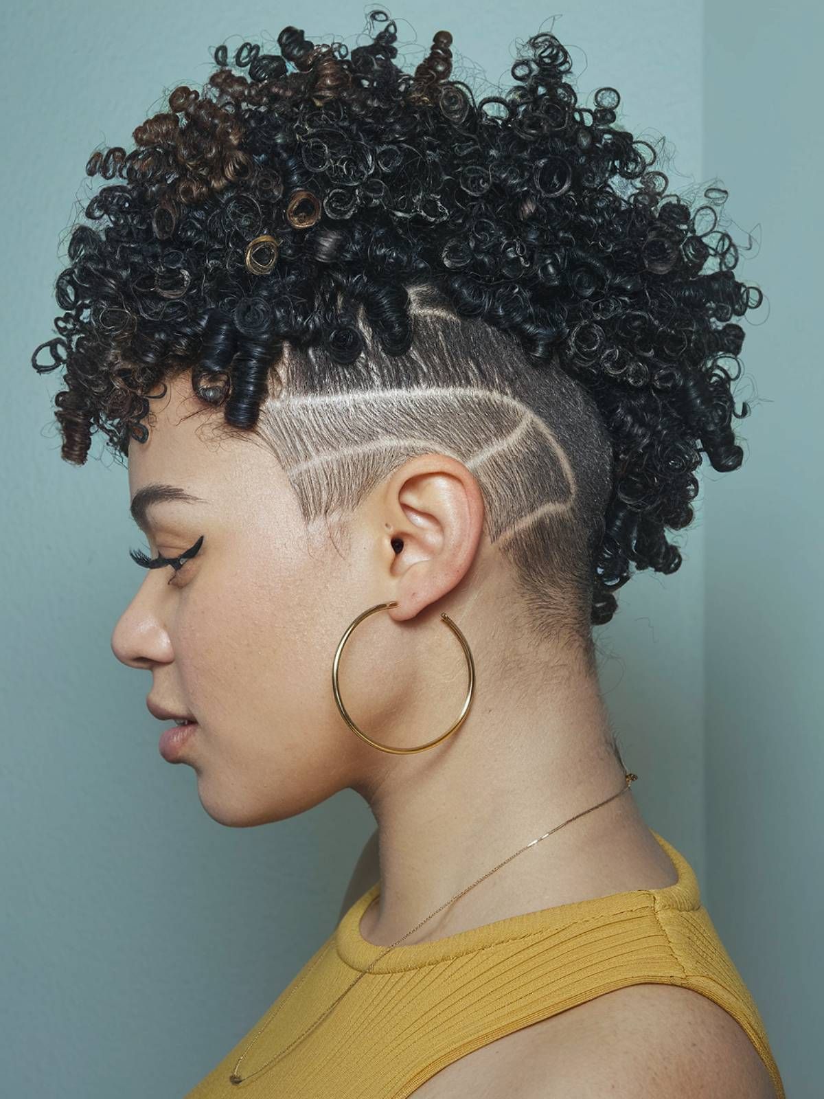 Black Curly Hair with Geometric Line Design — Undercut Hairstyles for Women