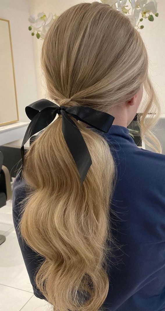 Voluminous Blonde Ponytail With Black Bow — Low Ponytail with Bow