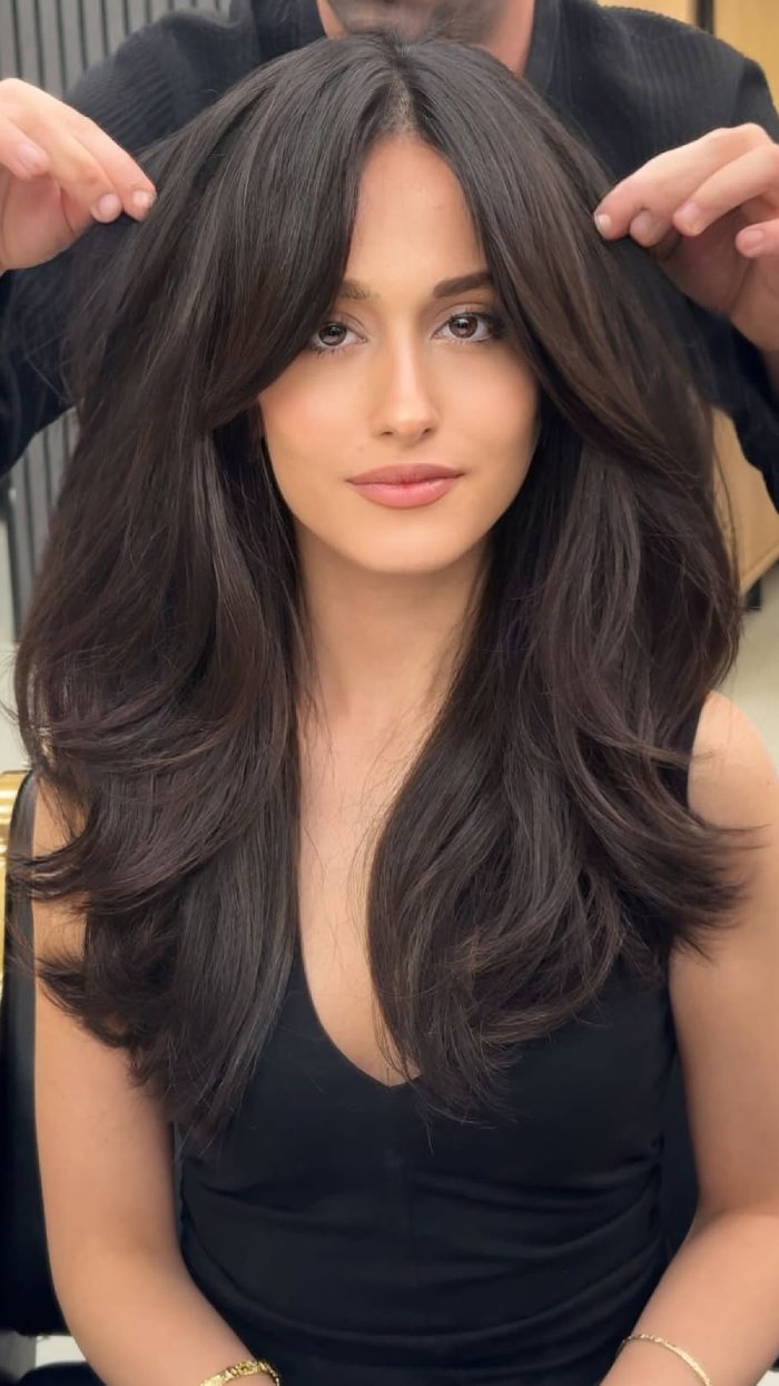 Long Hair with Curtain Bangs and Full Layers in Soft Black-Brown