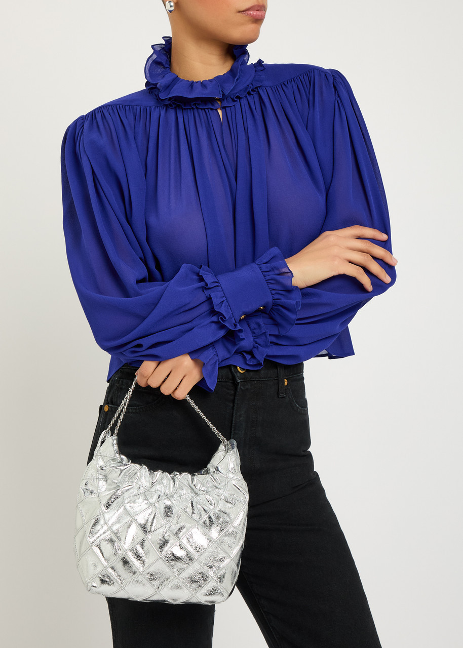 Silver Metallic Hobo Bag with Ruffled Blouse and Black Jeans — Hobo Bag Outfits