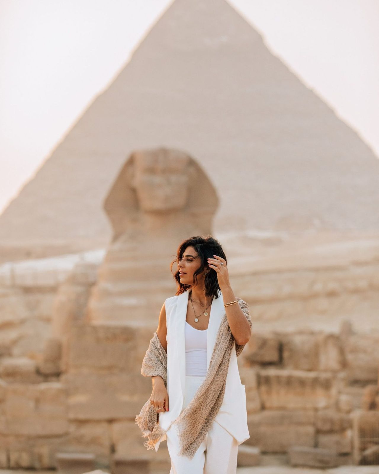 Chic Layering with a White Vest and Patterned Scarf Chic Layering with a White Vest and Patterned Scarf — Egypt Outfits
