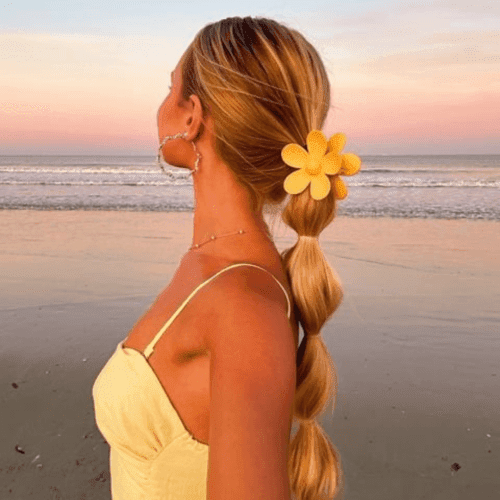 Bubble Ponytail with Floral Accent — Beach Hairstyles