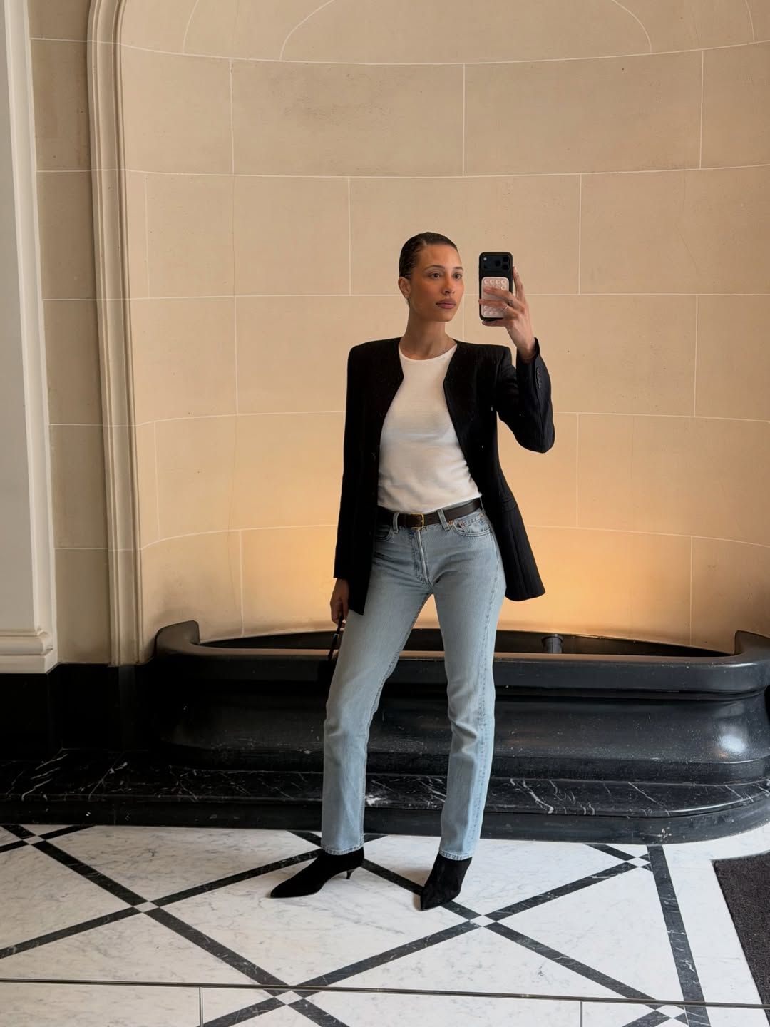 Sharp and Sleek: Fitted Jeans with a Black Blazer — Light Wash Jeans Outfits