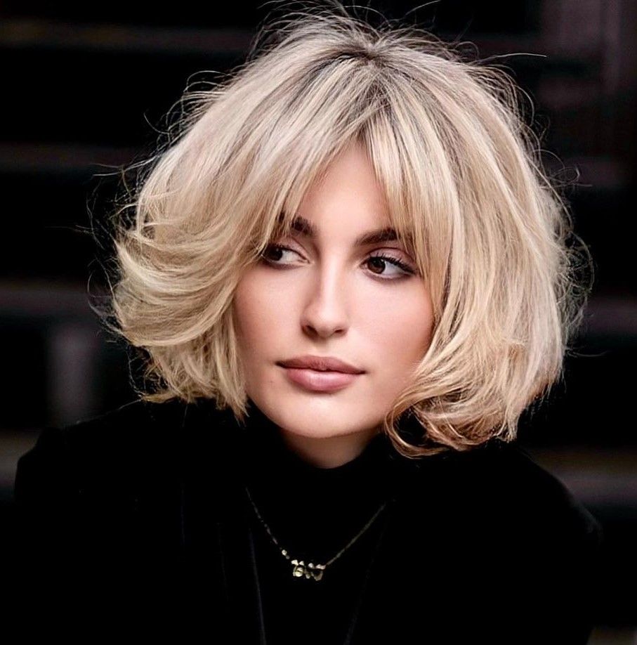 Voluminous Ash Blonde Bob With Curtain Bangs Voluminous Ash Blonde Bob With Curtain Bangs — Chin Length Bob
