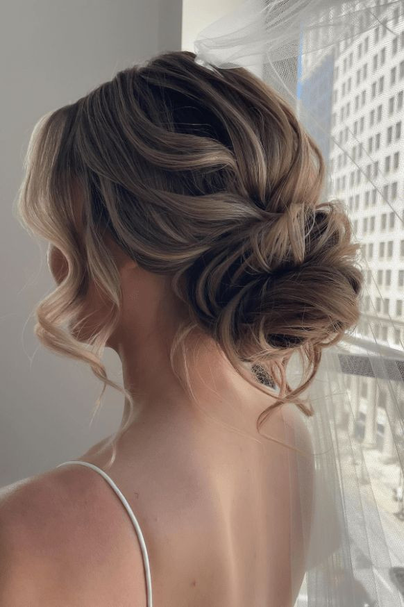 Ash Blonde Messy Bun with Curtain Bangs — Messy Low Bun