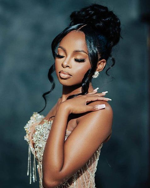 Voluminous Bun with Curtain Bangs — Prom Hairstyles for Black Women