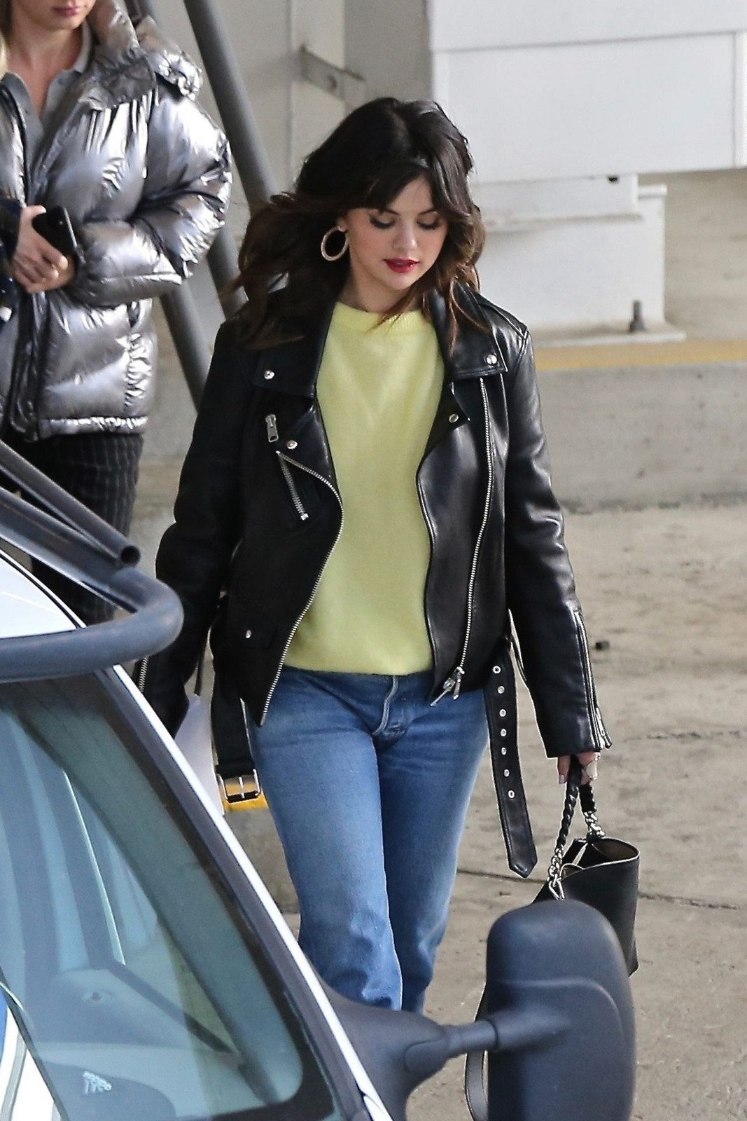 Leather Moto Jacket Over a Yellow Sweater with Blue Jeans Leather Moto Jacket Over a Yellow Sweater with Blue Jeans — Los Angeles Outfits