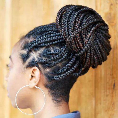 High Braided Bun With Loose Strands — Date Night Hairstyles