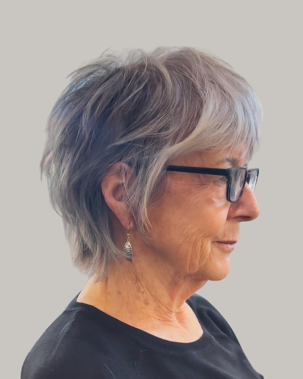 Tousled Grey Pixie With Wispy Fringe Tousled Grey Pixie With Wispy Fringe — Haircuts for Women Over 60 with Glasses