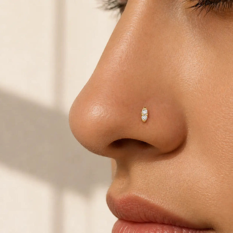 Elegant Gold Nose Stud with Oval Clear Stones Elegant Gold Nose Stud with Oval Clear Stones — Nose Piercing Ideas