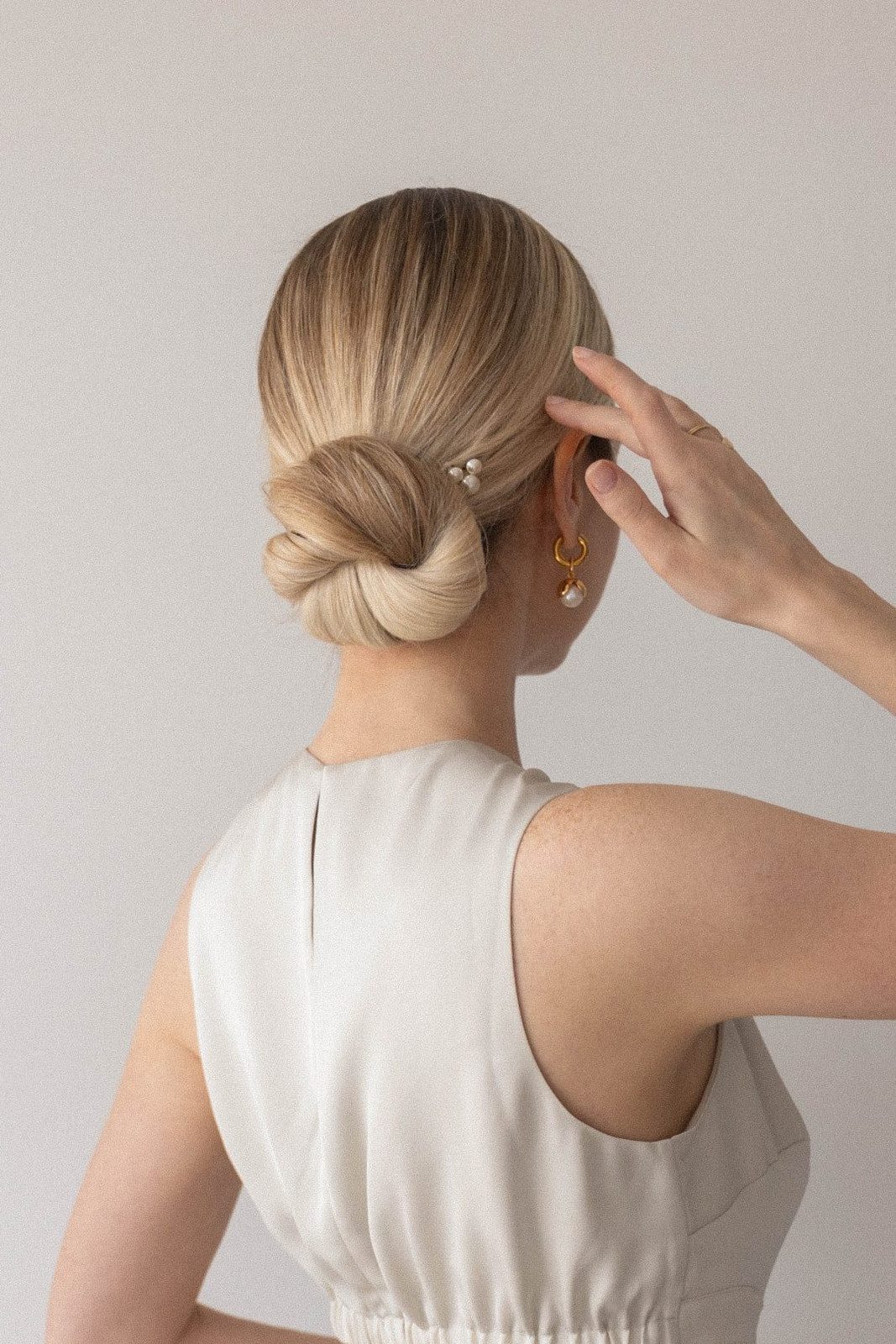 Sleek Ash Blonde Low Twisted Bun — Prom Updos