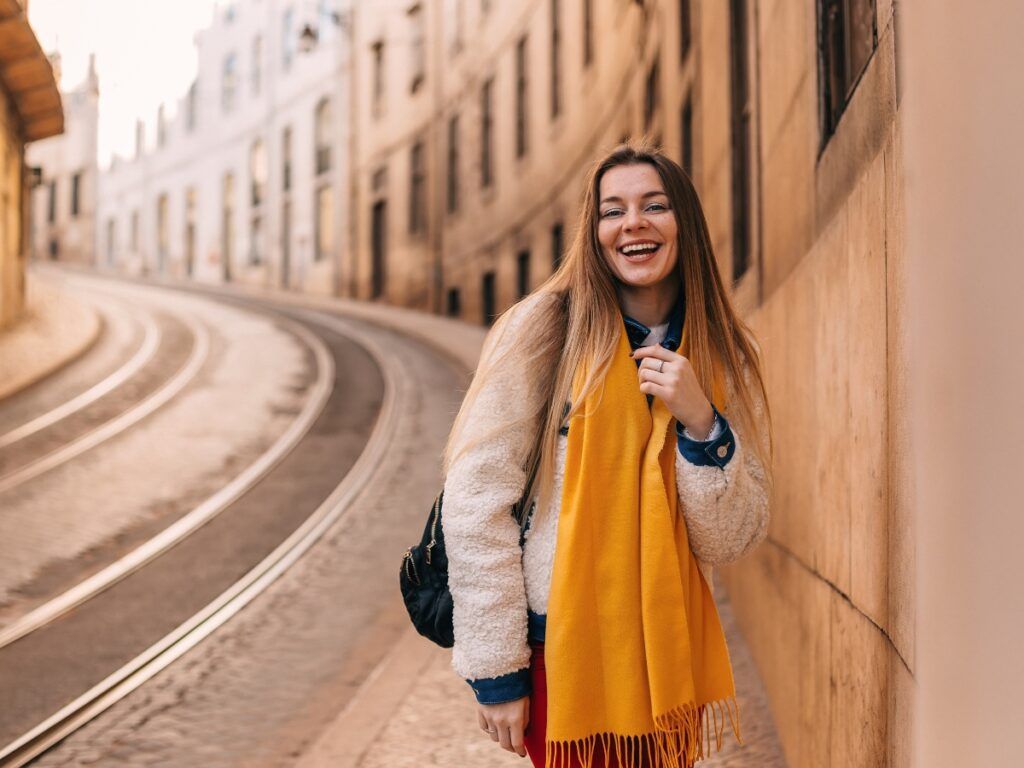 Cream Textured Jacket with Red Pants and Yellow Scarf — Lisbon Outfits