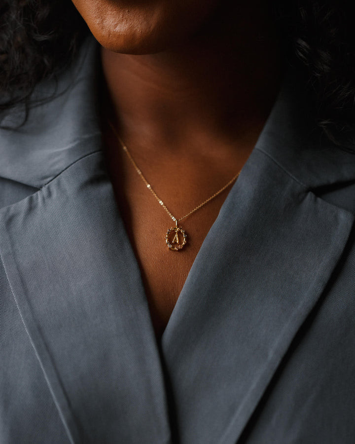 Circular Gold Initial Pendant on Charcoal Blazer Circular Gold Initial Pendant on Charcoal Blazer — Initial Necklaces