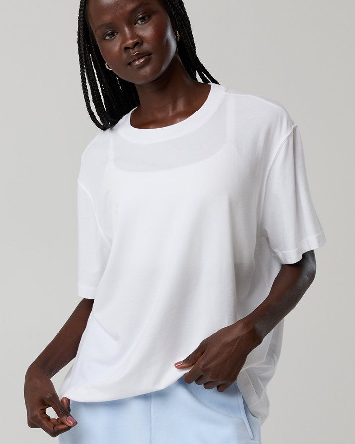 White Oversized T-Shirt Over White Bra with Light Blue Bottoms — Oversized Shirts