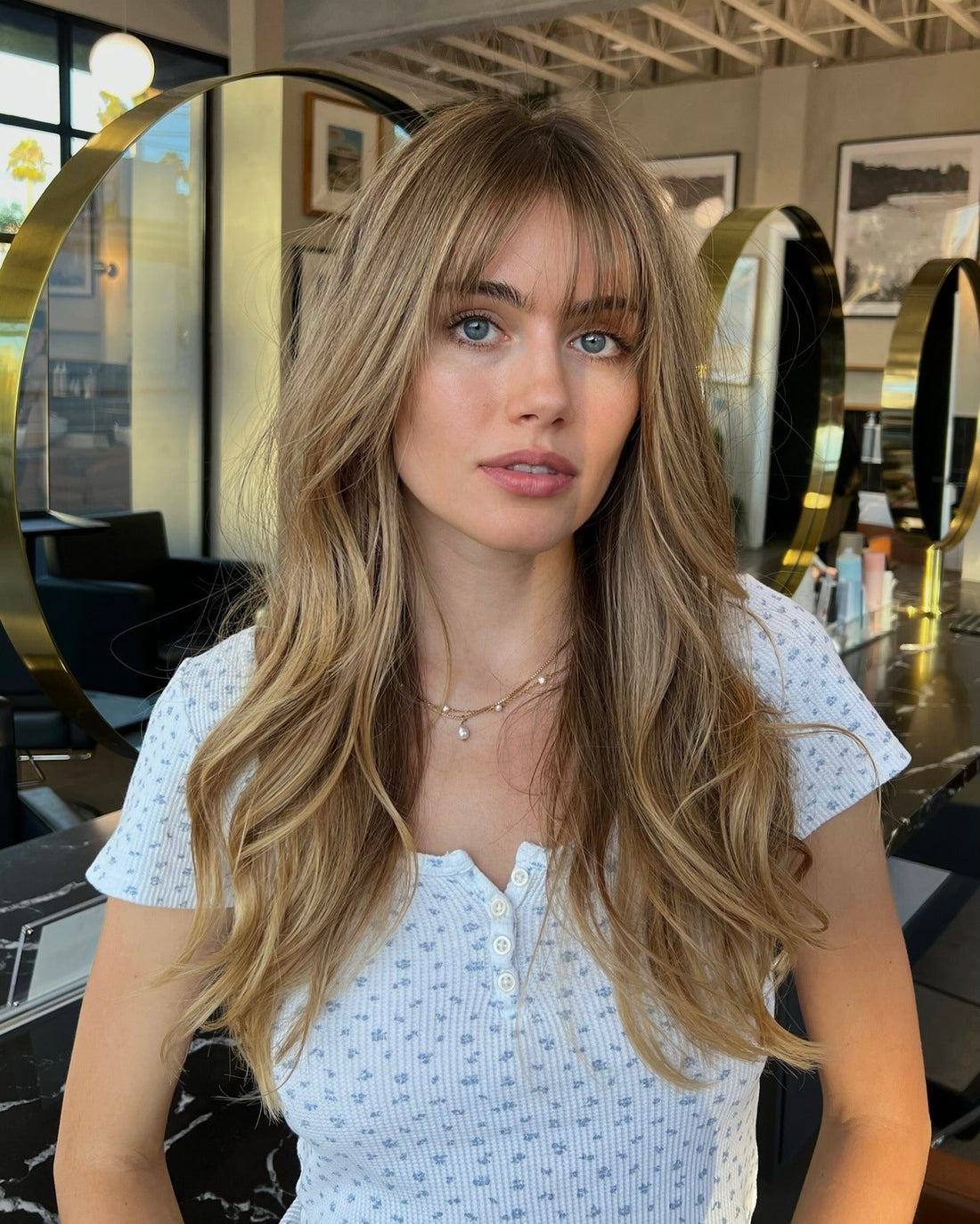 Boho Chic: Blonde Layers with Wispy Bangs and a Floral Top — Bangs with Layers