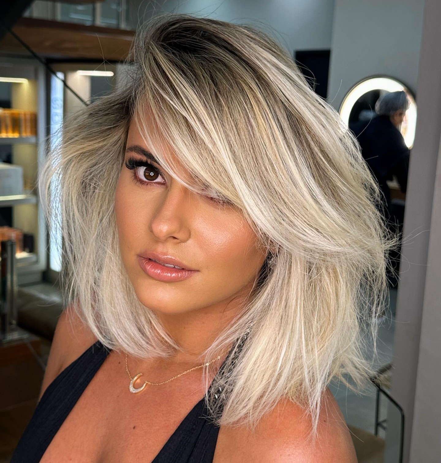 Evening Black Halter Top with Side-Swept Blonde Bangs Evening Black Halter Top with Side-Swept Blonde Bangs — Side Bangs