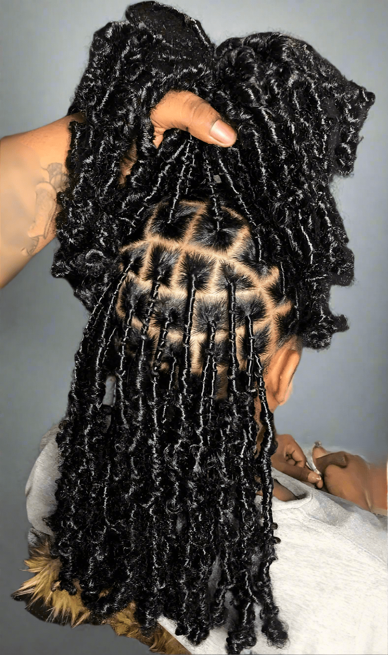 Dense Mid-Back Black Butterfly Locs — Showcasing A Dense And Wavy Texture