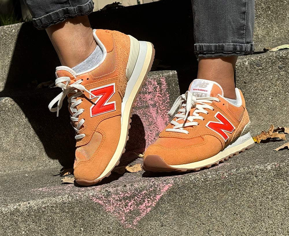 Vibrant Orange and Red 574s for a Bold Casual Look — New Balance 574 Outfits