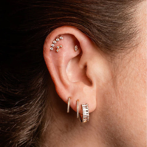 Elaborate Gold Stack with Baguette Hoop and Curved Studs Elaborate Gold Stack with Baguette Hoop and Curved Studs — Ear Stack Ideas