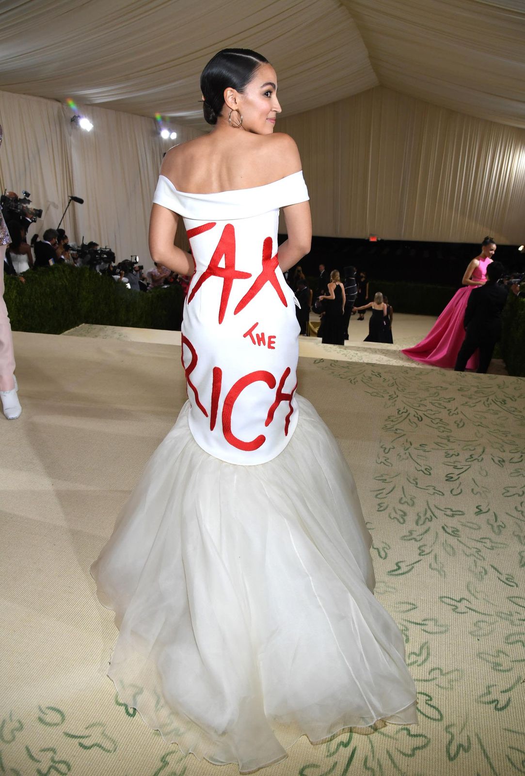 White Off-the-Shoulder Gown with 'TAX THE RICH' Slogan and Tulle Skirt White Off-the-Shoulder Gown with 'TAX THE RICH' Slogan and Tulle Skirt — Charity Gala Outfits