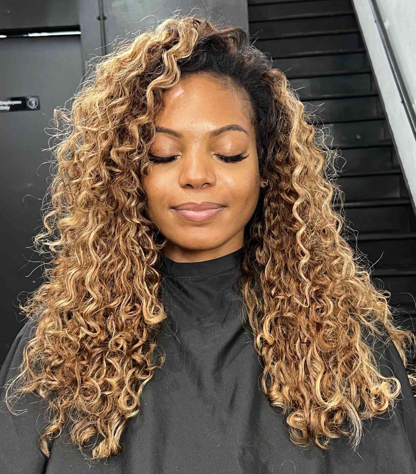 Vibrant Dark Blonde Curls with Highlights Vibrant Dark Blonde Curls with Highlights