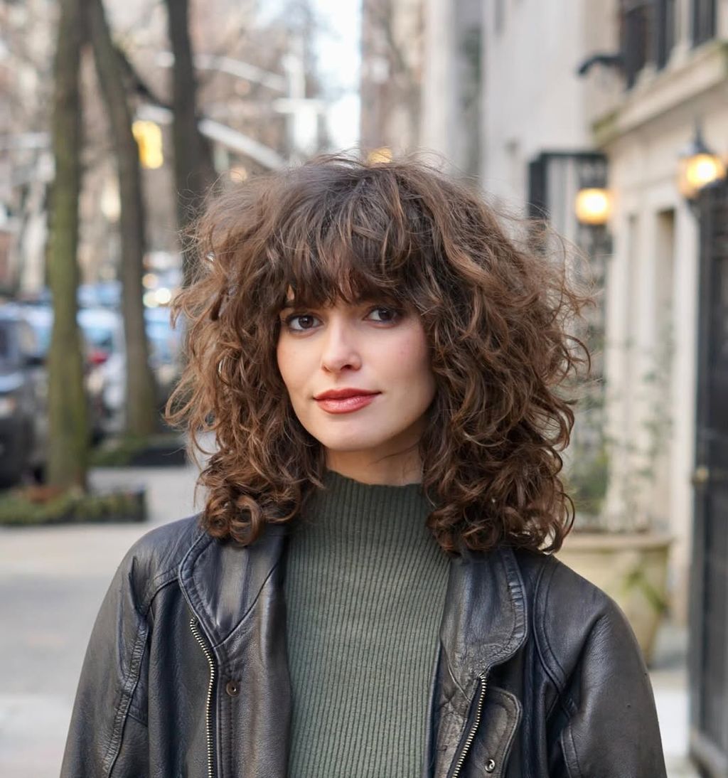 Edgy Black Leather Jacket Over Olive Turtleneck Edgy Black Leather Jacket Over Olive Turtleneck — Curly Bangs