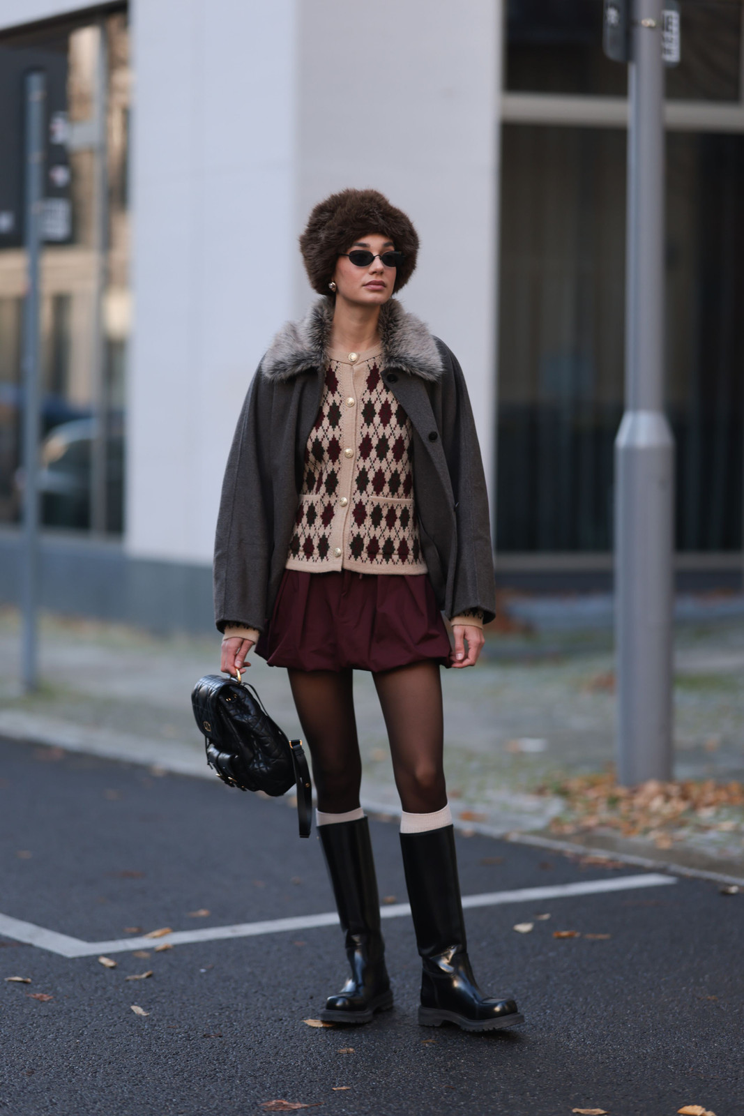 Fashion-Forward Layers: Mini Skirt, Oversized Coat, and Textured Backpack — Backpack Outfits Women