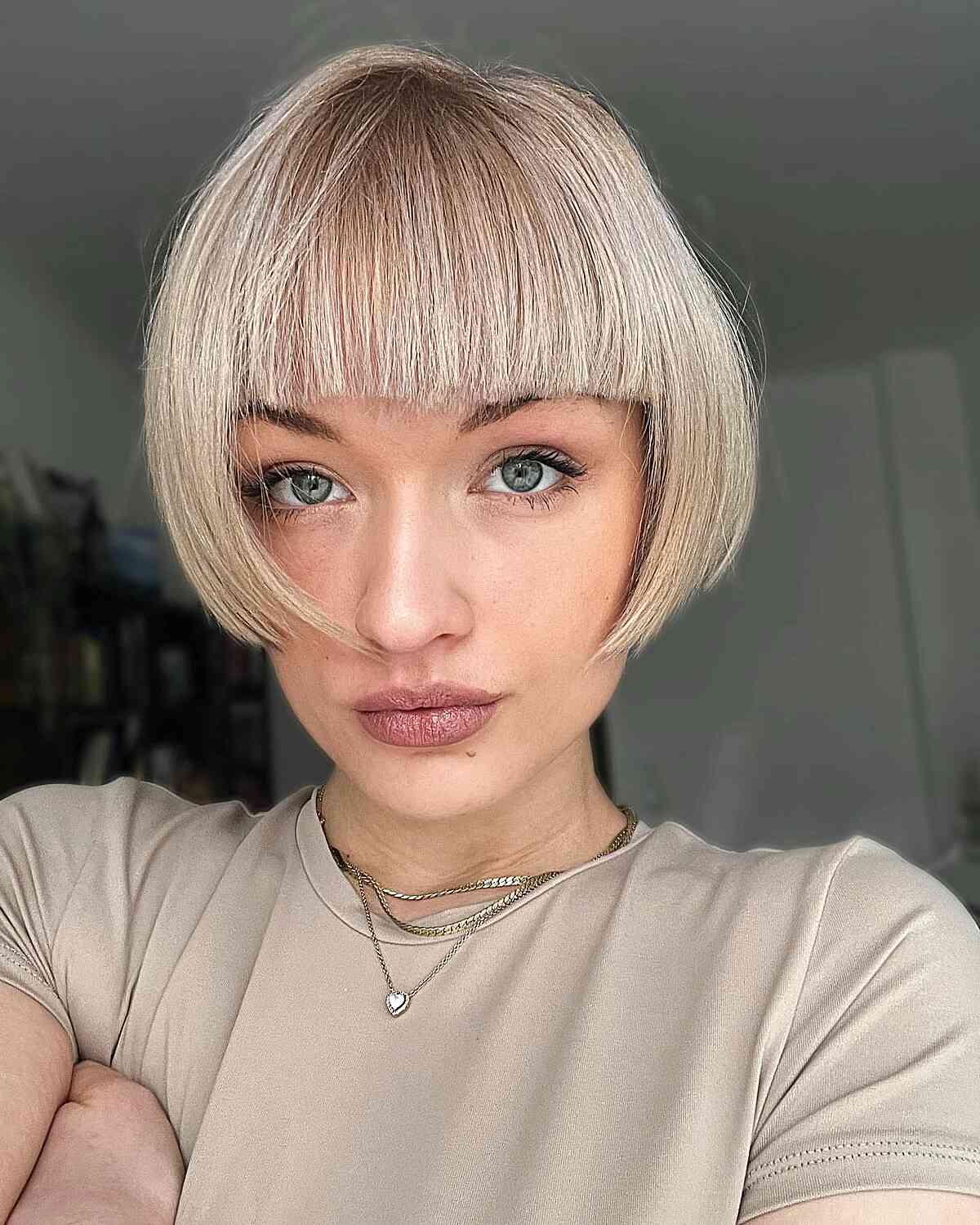 Casual Beige Tee with Short Bangs and Layered Necklaces
