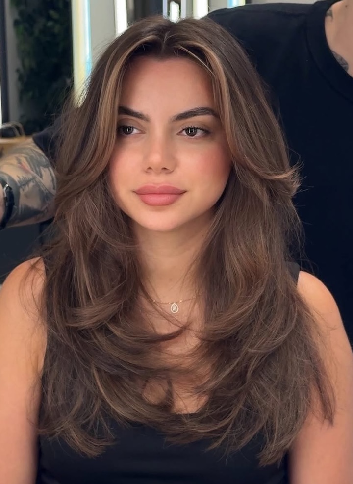 Long Layers with Curtain Bangs for Soft Face Framing
