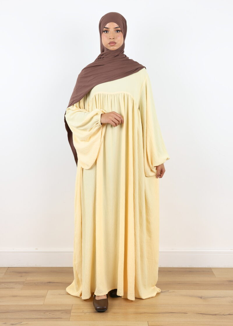 Pale Yellow Abaya with Textured Fabric and Voluminous Sleeves — Abaya Outfits
