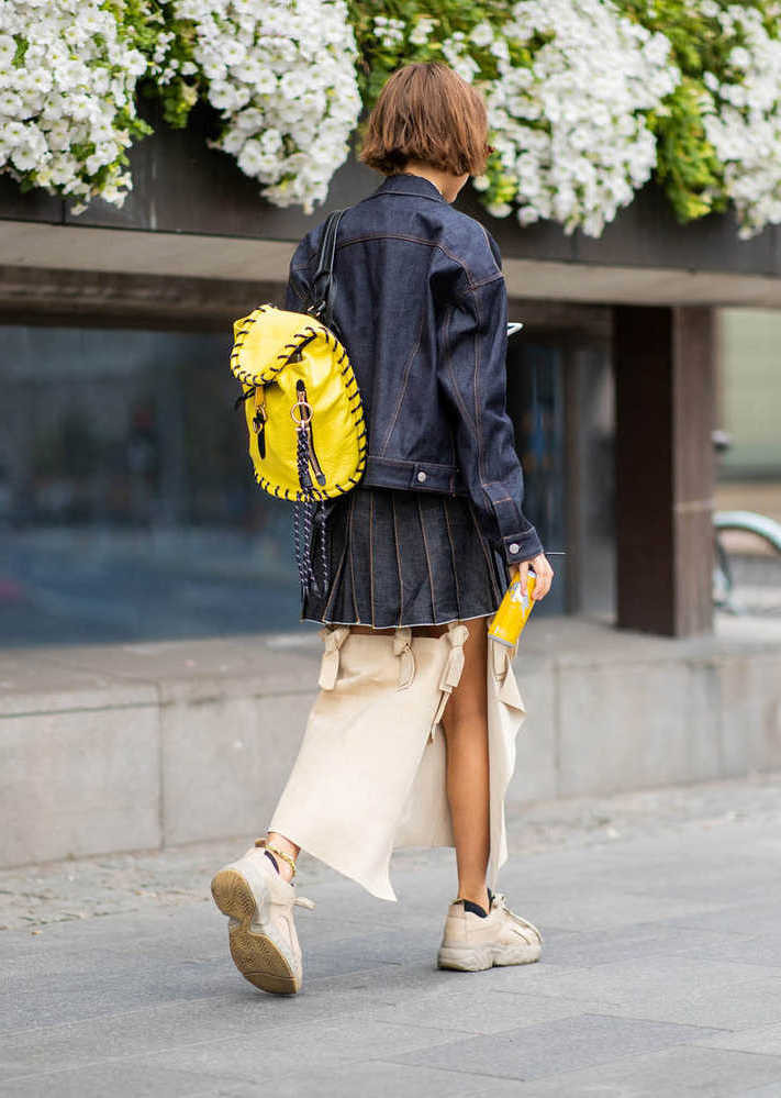 Bold and Bright: Yellow Backpack with Denim and Chunky Sneakers — Backpack Outfits Women
