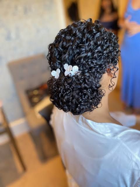 Neat Updo With Floral Pins Neat Updo With Floral Pins — Wedding Hairstyles for Curly Hair