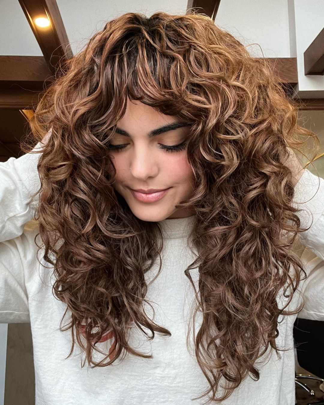 Medium Brown Defined Curly Layers And Bangs — Long Wolf Cut