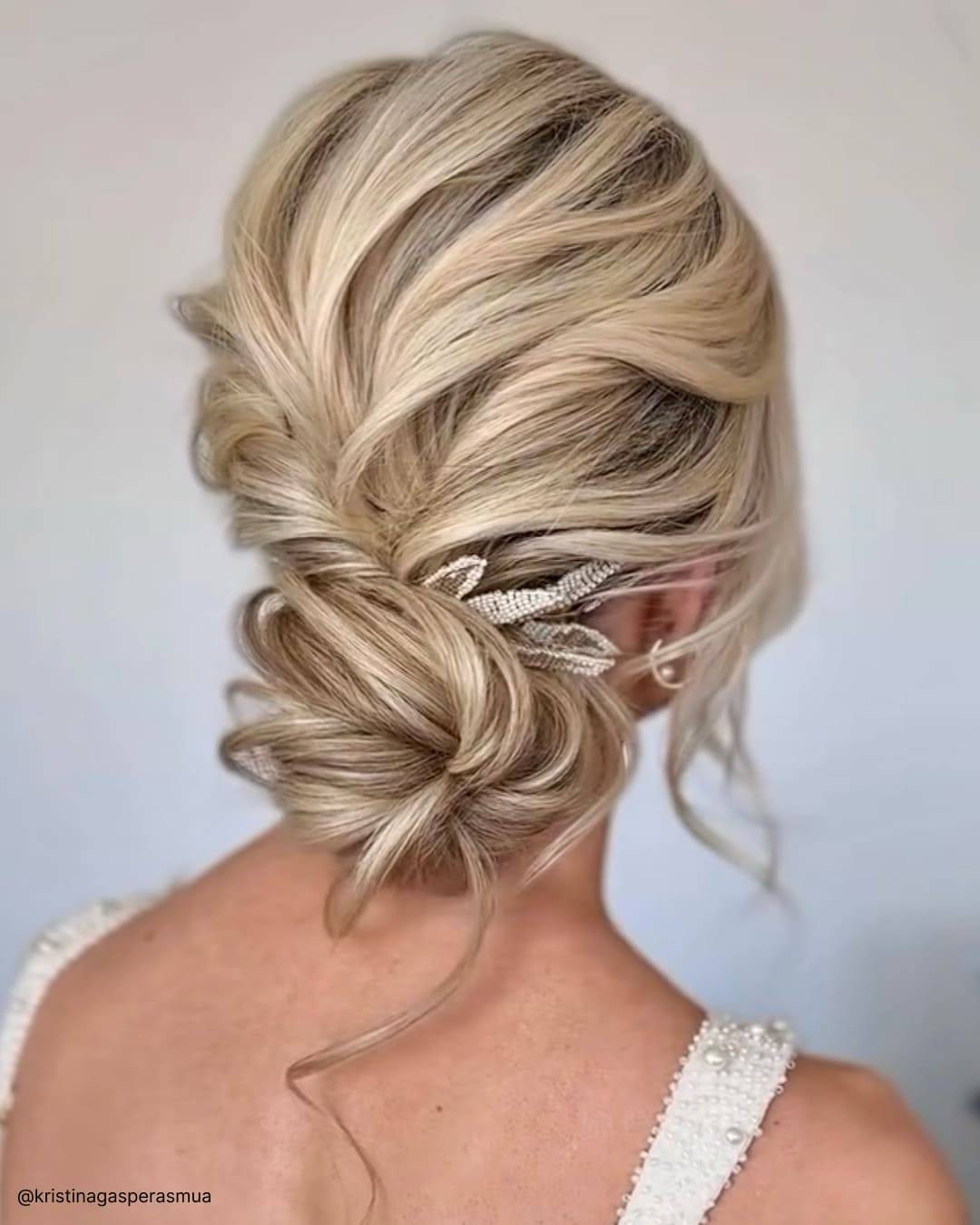 Elegant Ash Blonde Bun with Accessory — Messy Low Bun