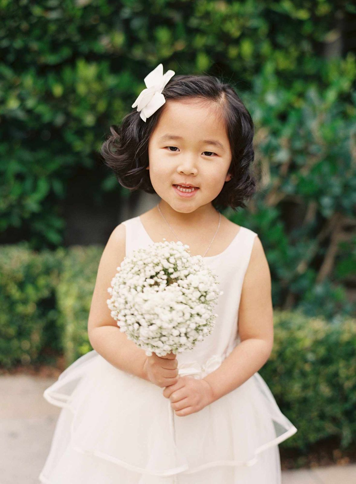 Dark Brown Bob with Soft Curls and Flower — Baby Shower Hairstyles
