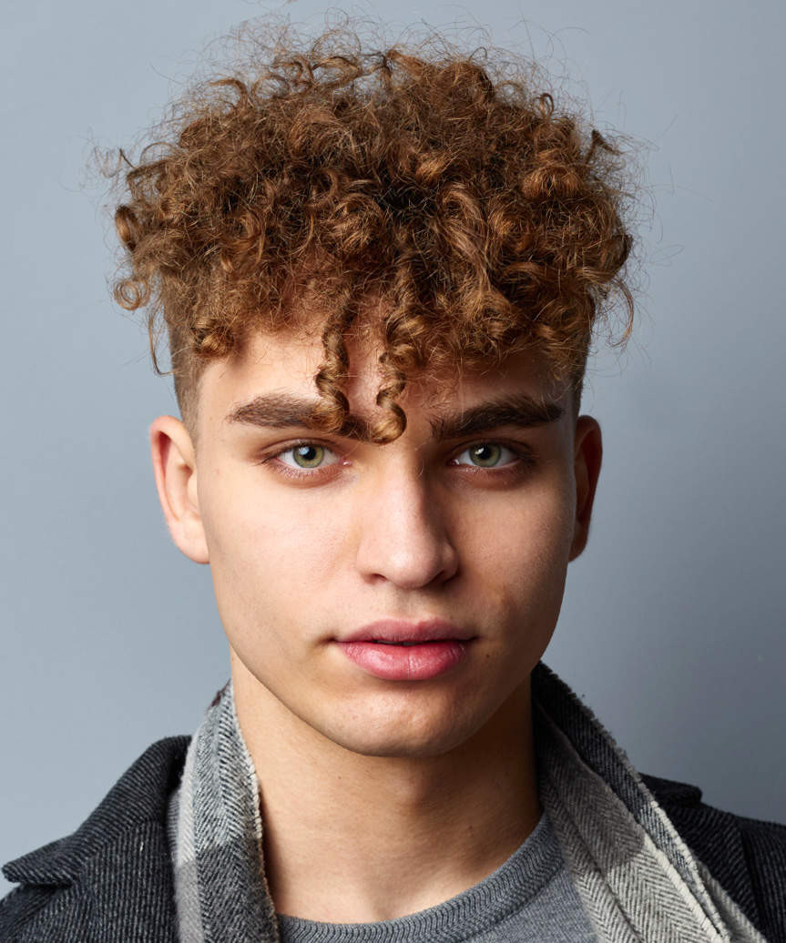 Short Voluminous Curls With Defined Bangs — Curly Hairstyles for Men