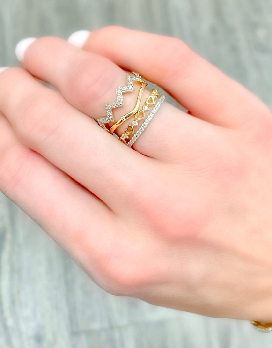 Chevron and Heart Details in a Gold Stack Chevron and Heart Details in a Gold Stack — Gold Ring Stack