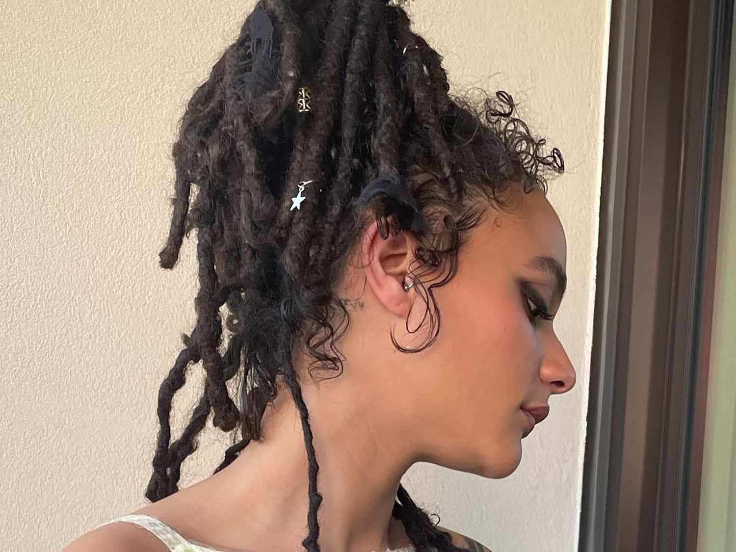 Thick Black Loc Ponytail With Charms