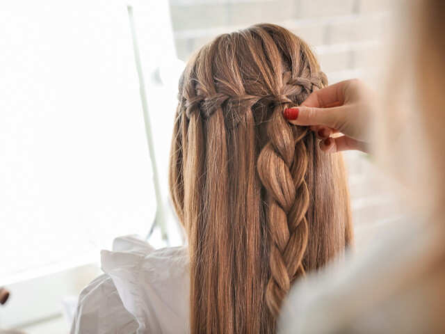 Light Brown French Braid with Face-Framing Strands