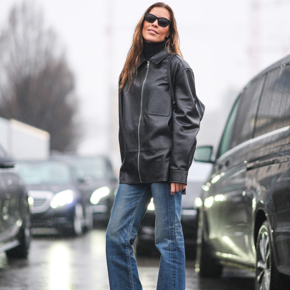 Classic Cool: Blue Jeans with Leather Jacket, Turtleneck, and Backpack Classic Cool: Blue Jeans with Leather Jacket, Turtleneck, and Backpack — Bootcut Jeans Outfits