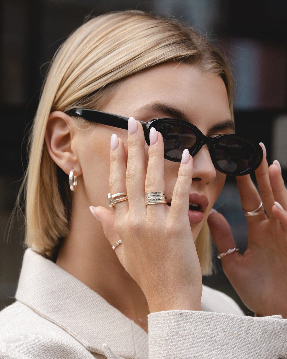 Stacked Textured Gold Rings with a Cream Jacket — Chunky Rings
