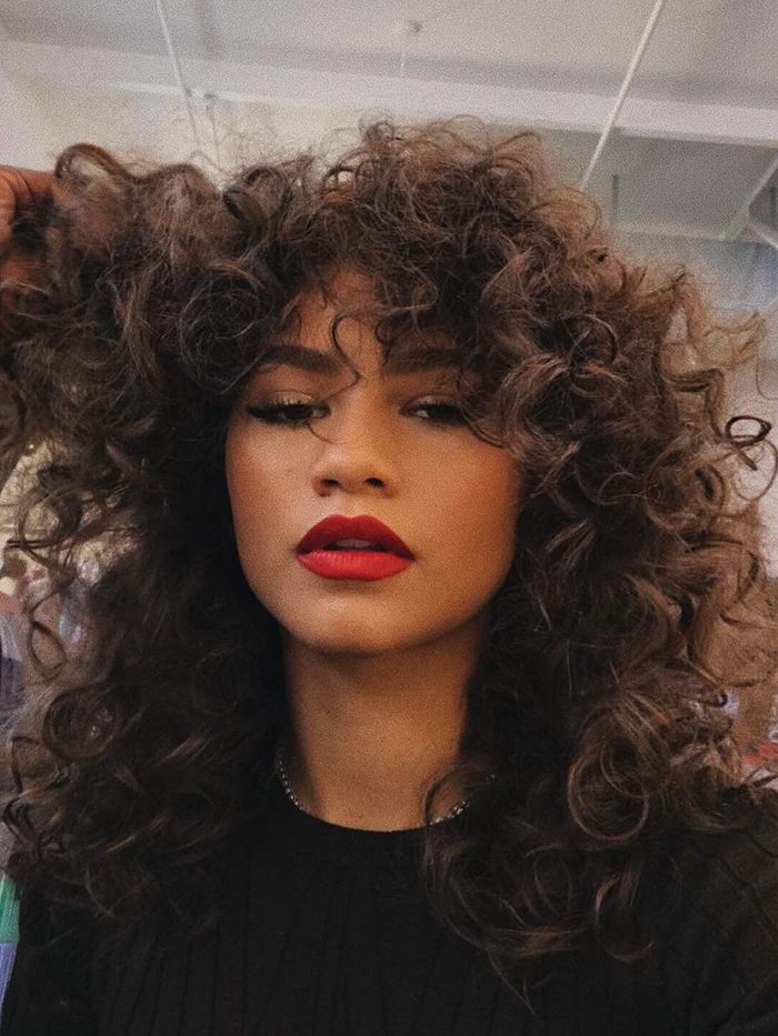 Voluminous Mid-Back Curly Dark Brown Voluminous Mid-Back Curly Dark Brown — 70s Hairstyles